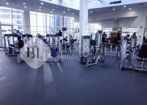 a gym with cardio equipment in a building at Bloomfields Studio in Hydra Avenue - Reem in Abu Dhabi