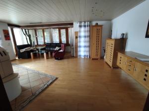 a living room with a couch and a table at Schöner Wohnen in Rheinau