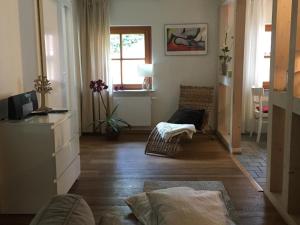 a living room with a couch and a window at Apartment Waldblick by Interhome in Bleckede