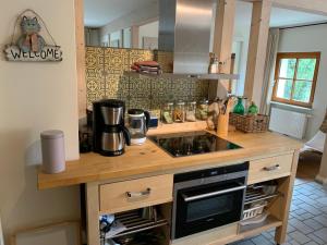 a kitchen with a counter with a stove top oven at Apartment Waldblick by Interhome in Bleckede