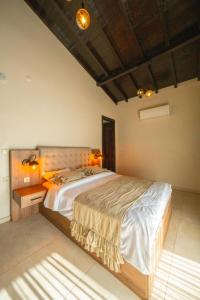 a bedroom with a large bed with lights on it at Monk By The Lake Sapanca in Sapanca +79 photos
