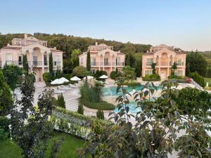 an aerial view of a mansion with a swimming pool at Olympia Sozopol in Sozopol