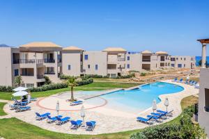 an image of a swimming pool at a resort at Resitour - Aphrodite Beachfront in Pírgos Psilonérou