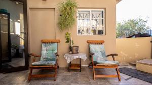 two chairs and a table on a porch at Home Sweet Home in Springbok