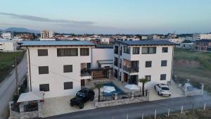 a house with a car parked in front of it at Vile Relax in Donji Štoj
