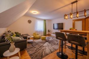 a living room with a couch and a table at Hotel Ochsen in Bad Saulgau