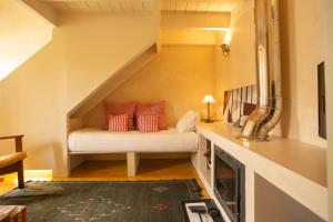 a room with a bed in the middle of a stairs at Estúdio 24 na Boavista, JAMBA House in Porto