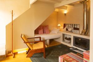 a living room with a bed and a fireplace at Estúdio 24 na Boavista, JAMBA House in Porto