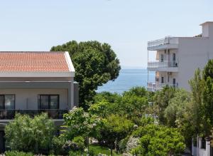 a view of the ocean from a building at AMARÉ suites in Nikiti