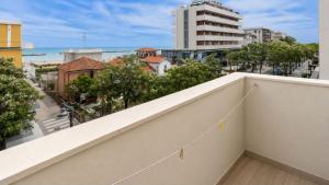 a balcony with a view of a city at Hotel Continental in Gatteo a Mare
