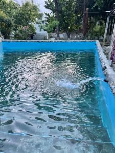 a pool with water being poured into it at The Pecan Resort in Gilgit