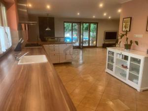a kitchen with a counter top in a room at CUKROS Villa in Cserkeszőlő