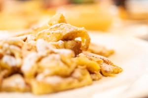 a pile of food on a white plate at Berghotel Zugspitzblick in Zöblen
