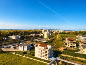 an aerial view of a city with buildings and cars at Sunset Terrace in Durrës