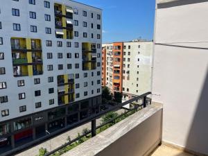 a balcony with a view of some buildings at Olive in Tirana