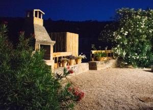 a house with potted plants in a yard at VILLA MADRE in Marina Serra