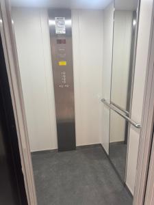 a elevator in a building with a glass door at Hotel Doc in Vairano Scalo