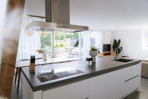 a kitchen with a sink and a window at Oase in Bergen