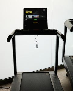 a treadmill with a laptop on top of it at Domina Milano Fiera in Novate Milanese