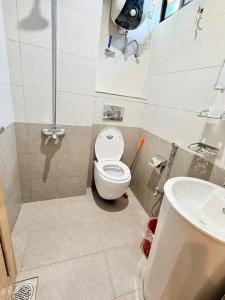 a bathroom with a toilet and a sink at Hotel Islamabad Premiere Inn in Islamabad +27 photos