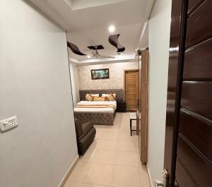 a hallway with a bed in a room at Hotel Islamabad Premiere Inn in Islamabad
