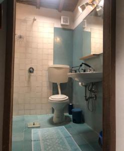 a bathroom with a toilet and a sink at Antica Verdureria in Terme di Castel Doria +21 photos