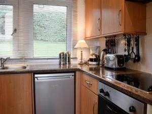a kitchen with a sink and a counter top at Ruach in Gardenstown