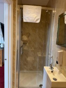 a bathroom with a shower and a sink at Hotel Hudson in Torquay +64 photos