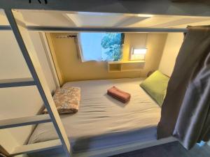 a bunk bed in a small room on a ship at DK1Hostel in Chaweng