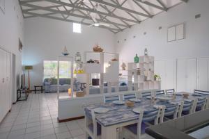 a dining room with a table and chairs at Kuda Breeze in St Lucia
