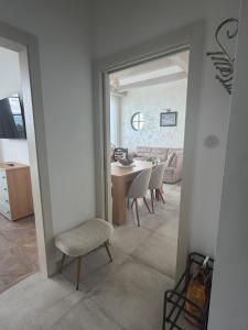 a kitchen and dining room with a table and chairs at Farma HUGÁNIKOVO - families, pets & spa relaxation in Brezno