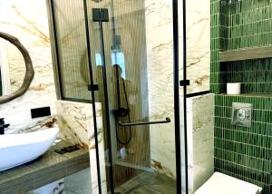 a bathroom with a shower and a sink at 7 Baits Hotel in Tbilisi City +58 photos
