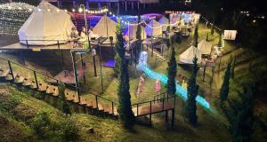 an overhead view of a party with tents and a pool at Peace Zone เขาค้อ in Khao Kho