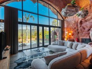 a living room with a large glass wall at Arborea Hotel in Trabzon