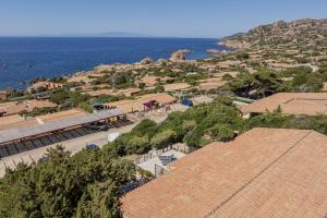 an aerial view of a town next to the ocean at Villetta Luce Marina in Costa Paradiso