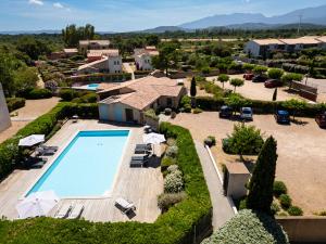 an aerial view of a villa with a swimming pool at Casa Mia in Porto-Vecchio