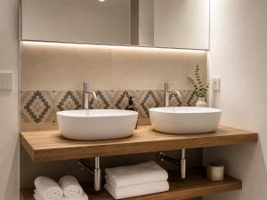two sinks on a wooden shelf in a bathroom at Astra - Exclusive Rooms in Castelsardo +27 photos