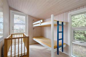 a bunk bed in a room with a staircase at 8124-Ronde-Rytterparken-33 in Rønde