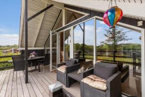 a porch with a hot air balloon in the sky at 8923-Allingabro-Poppelvej-17 in Allingåbro