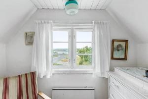 a bathroom with a window with a view of the ocean at 1102-N-Hundested-Skansevej-45 in Hundested +13 photos