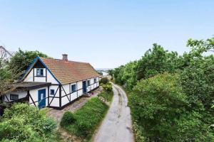 a house on a hill with a dirt road at 1102-N-Hundested-Skansevej-45 in Hundested