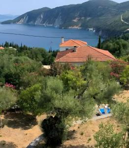 a house with a view of the lake at Afales Villa and Studios in Exoyí