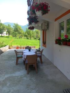 a patio with tables and chairs in a building at Apartment with two bedrooms in Glogošnica