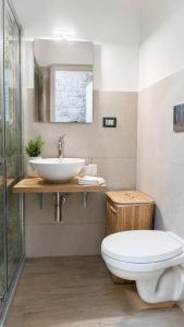 a bathroom with a toilet and a sink at Rallenta Casamassima in Casamassima