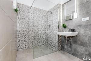 a bathroom with a sink and a shower at KORZO LIPNO C in Lipno nad Vltavou +53 photos