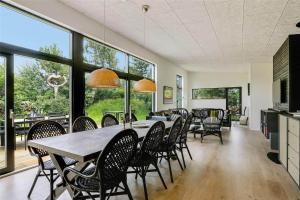a dining room with a table and chairs at 30159-Odder-Thorasvej-24 in Odder