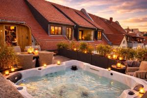 a hot tub on the patio of a house at The Summit Rooftop I Meissen in Meißen