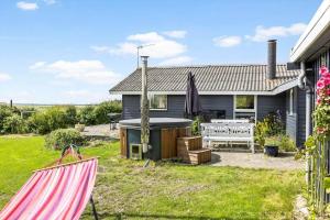 a house with a hot tub in a yard at LF212-Vestervig-Ingersvej-12 in Vestervig