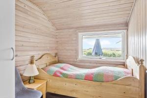 a bedroom with a bed and a window at LF212-Vestervig-Ingersvej-12 in Vestervig