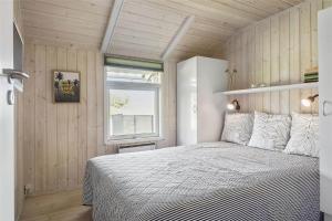 a bedroom with a bed and a window at 30510-Odder-Elmegaardsvej-8 in Odder